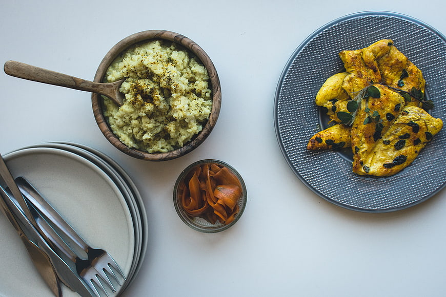 Top view of paleo chicken breast with mashed cauliflower