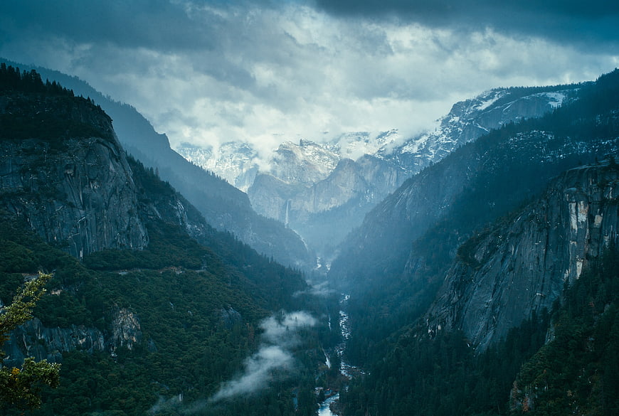 Misty Yosemite Valley Landscape with Snow-Capped Mountains