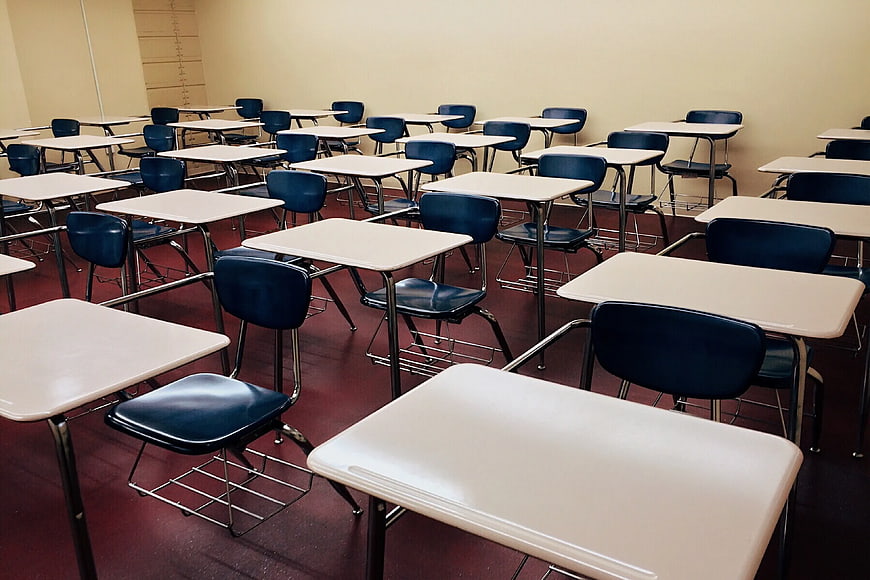 Empty Classroom with Rows of Desks and Chairs