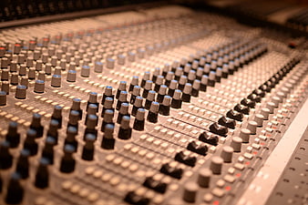 Close-up of professional audio mixing console in recording studio