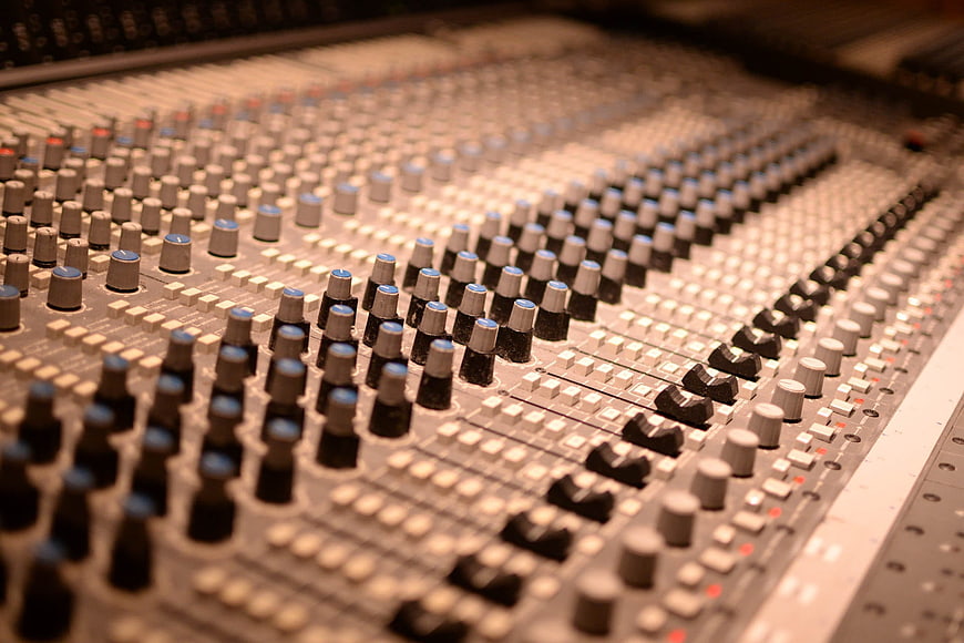 Close-up of professional audio mixing console in recording studio