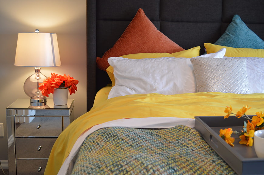 Modern Bedroom Interior with Yellow Bedding and Decor