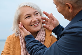 Senior couple sharing affectionate moment outdoors