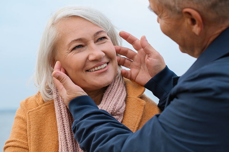 Senior couple sharing affectionate moment outdoors