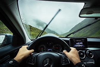 Driving Mercedes on Rainy Mountain Road