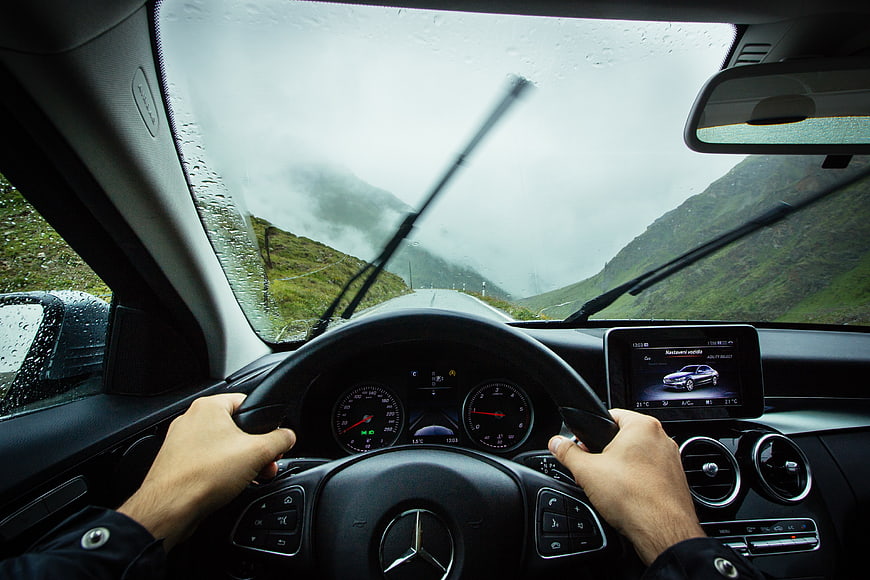 Driving Mercedes on Rainy Mountain Road