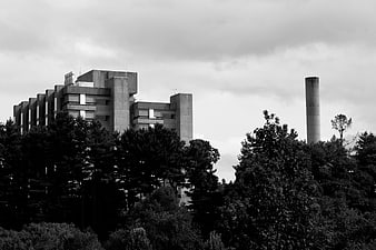 Black and White Brutalist Architecture with Smokestack