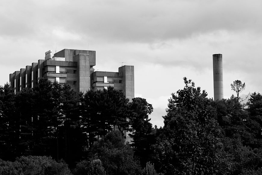 Black and White Brutalist Architecture with Smokestack