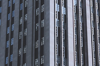 Modern High-Rise Building Facade with Vertical Window Patterns
