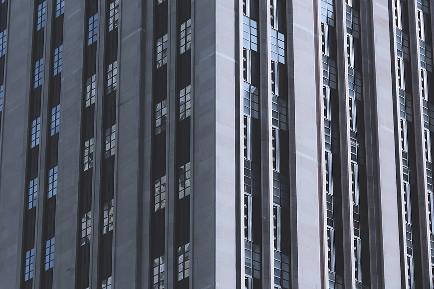 Modern High-Rise Building Facade with Vertical Window Patterns
