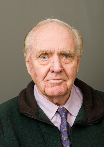 Senior Male Portrait With Serious Expression And Patterned Tie