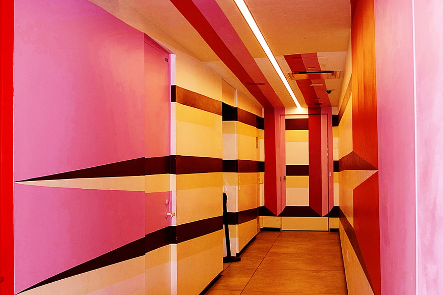 Vibrant Pink and Yellow Geometric Hallway Interior