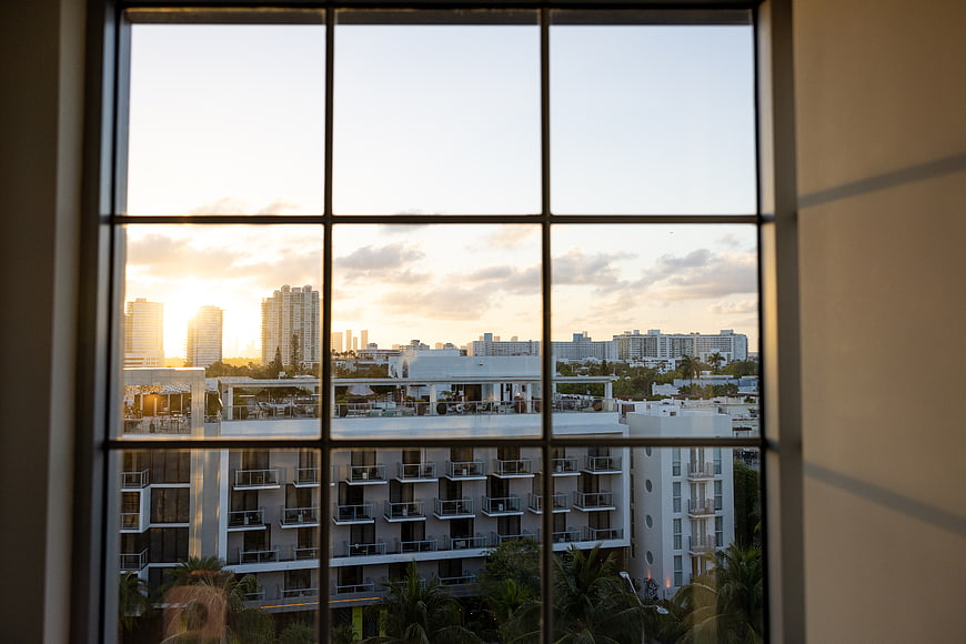 Sunset cityscape view through large window grid