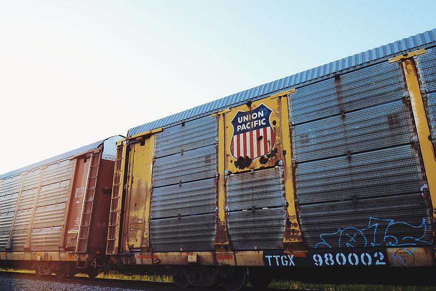 Rusty Union Pacific Freight Train Car on Tracks