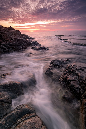 Long Exposure Sunset Over Rocky Coastal Tide Pools
