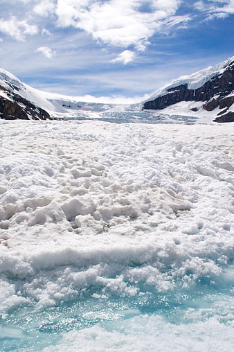 Glacier Landscape with Snowy Mountains and Blue Ice