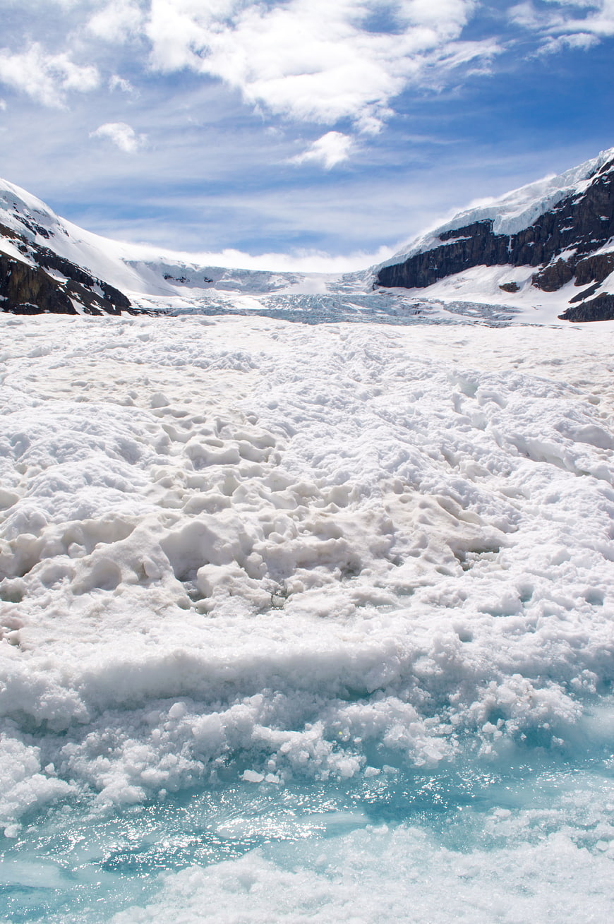 Glacier Landscape with Snowy Mountains and Blue Ice