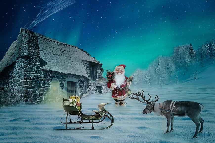 Santa Claus with Reindeer and Sleigh in Snowy Winter Landscape