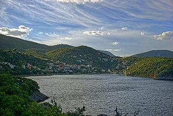 Scenic Mediterranean coastal village nestled in green hills