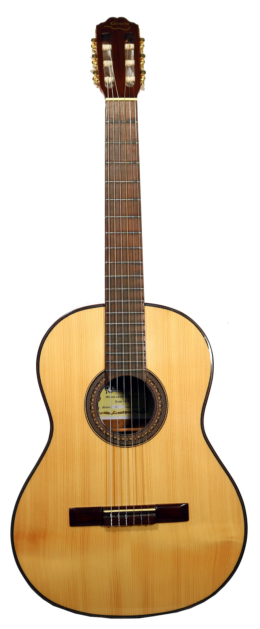 Full length classic acoustic guitar on white background