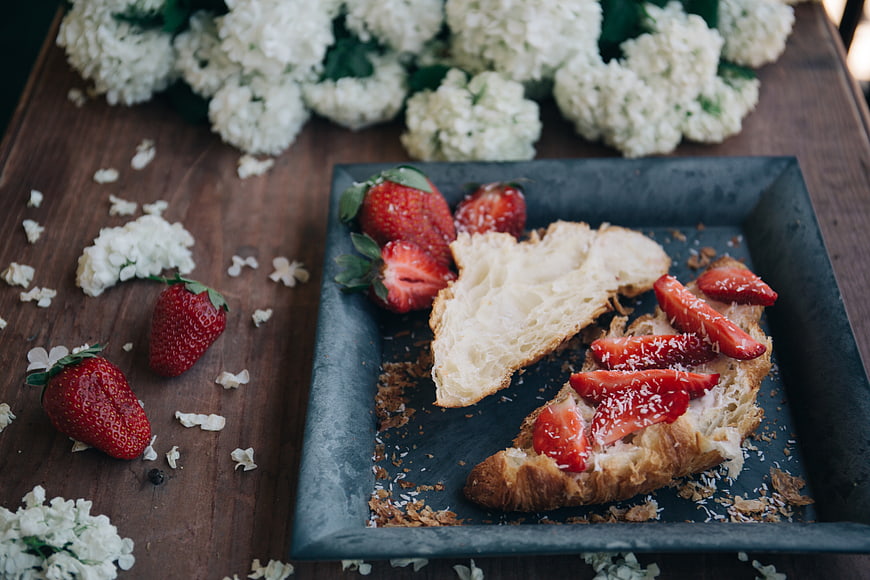 Strawberry Croissant Toast on Slate with White Flowers