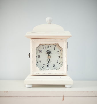 Vintage White Mantel Clock on Wooden Shelf