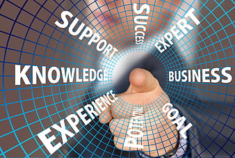 Businessman touching digital grid with success and knowledge text