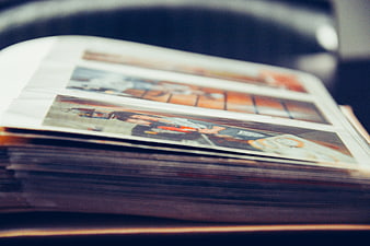 Close-up of a stack of printed photographs on a table