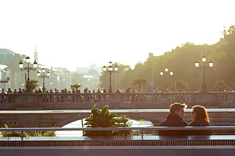 Romantic Couple Silhouette on Parisian Bridge at Sunset