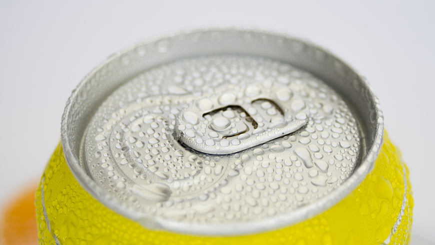Close-up of Cold Yellow Soda Can with Condensation