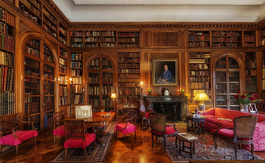 Luxurious historic library interior with wood paneling and books