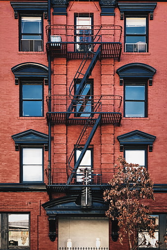 Red Brick Building Facade with Black Fire Escape