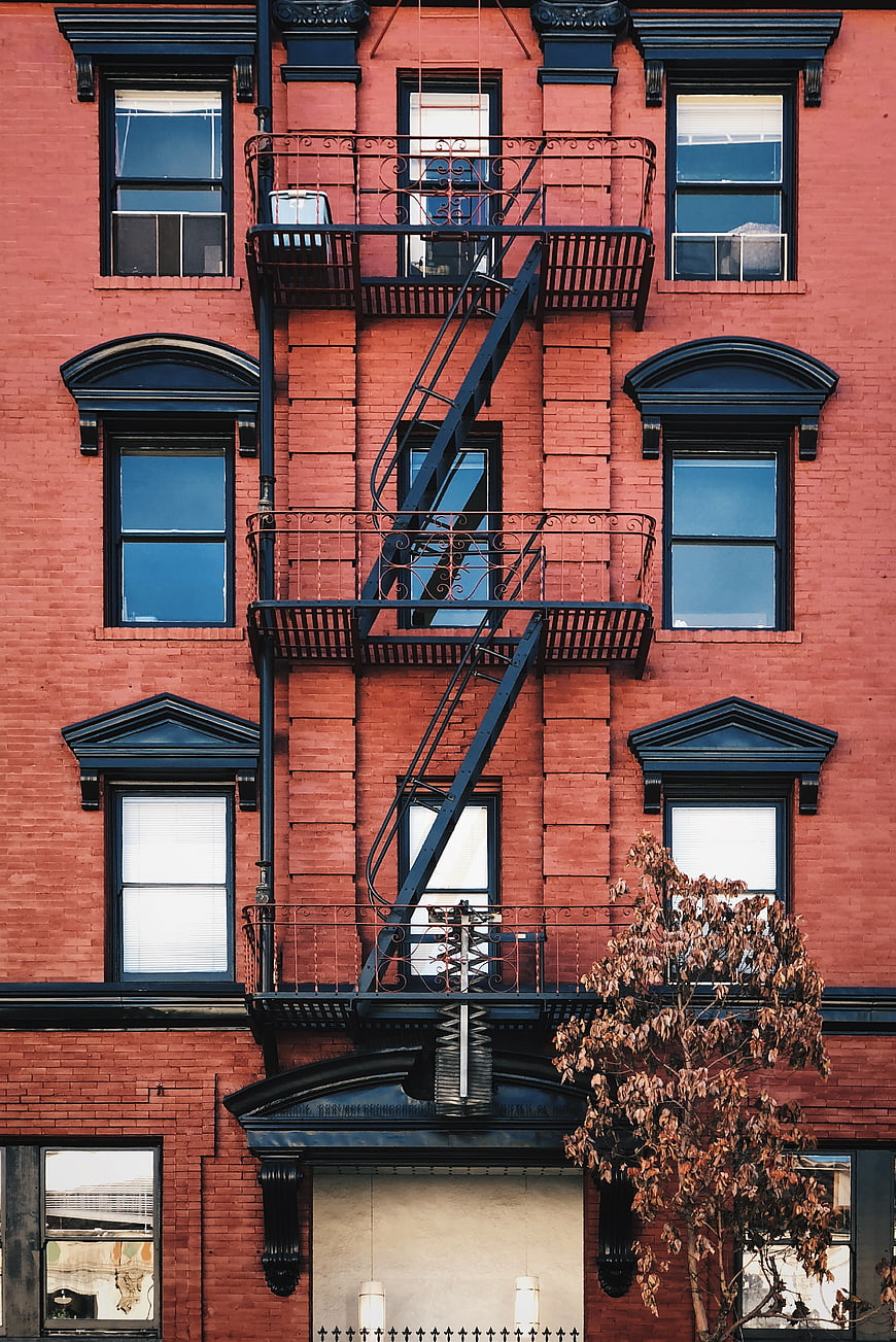Red Brick Building Facade with Black Fire Escape