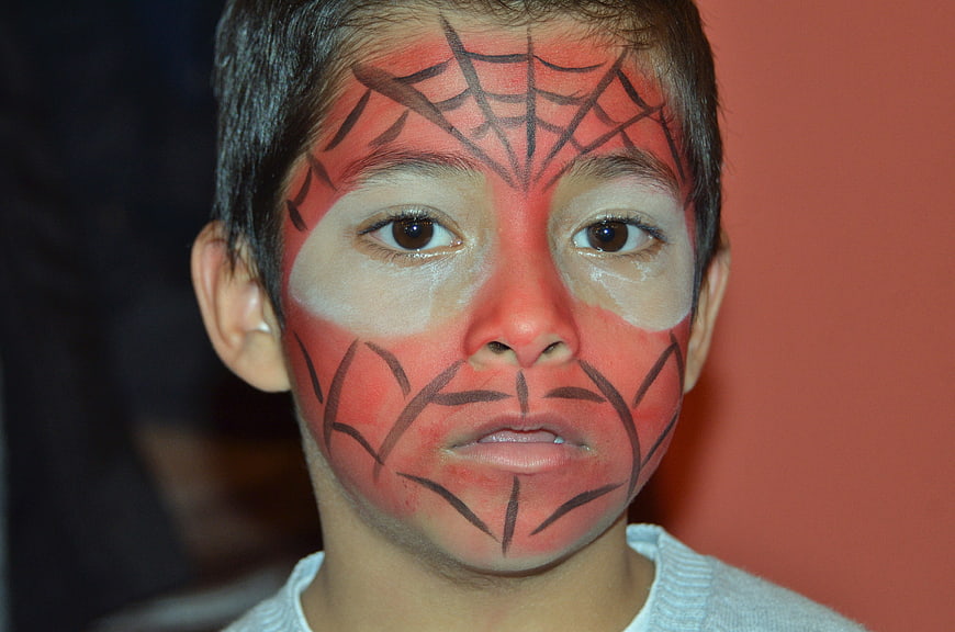 Close-up of boy with Spider-Man face paint