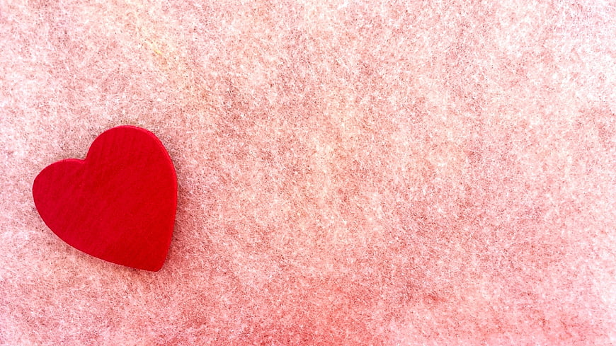 Red Heart on Pink Textured Background