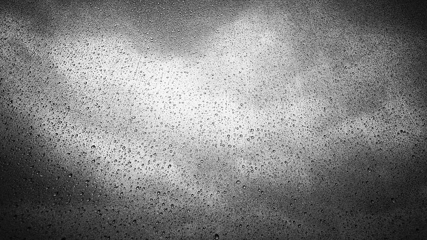 Black and White Raindrops on Glass Texture Background