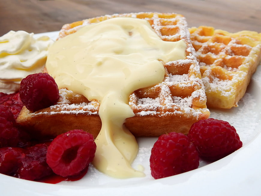 Golden Waffles with Custard, Raspberries, and Whipped Cream