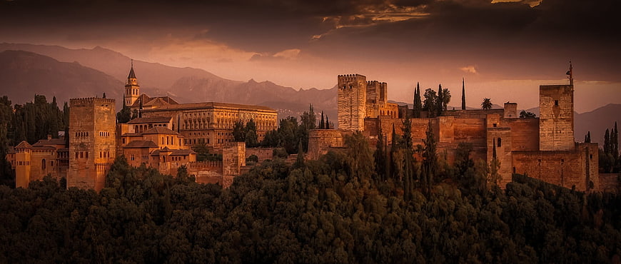 Alhambra Palace at Sunset with Mountains