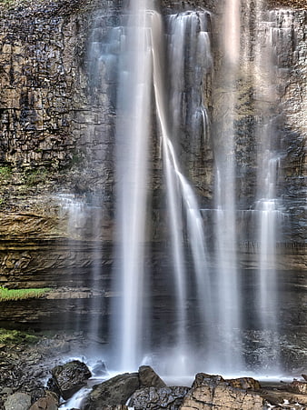 Majestic Waterfall Cascading Down Rocky Cliff Face