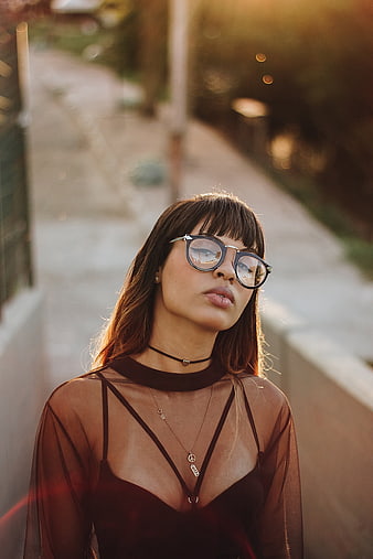 Stylish Woman with Glasses in Golden Hour Sunlight