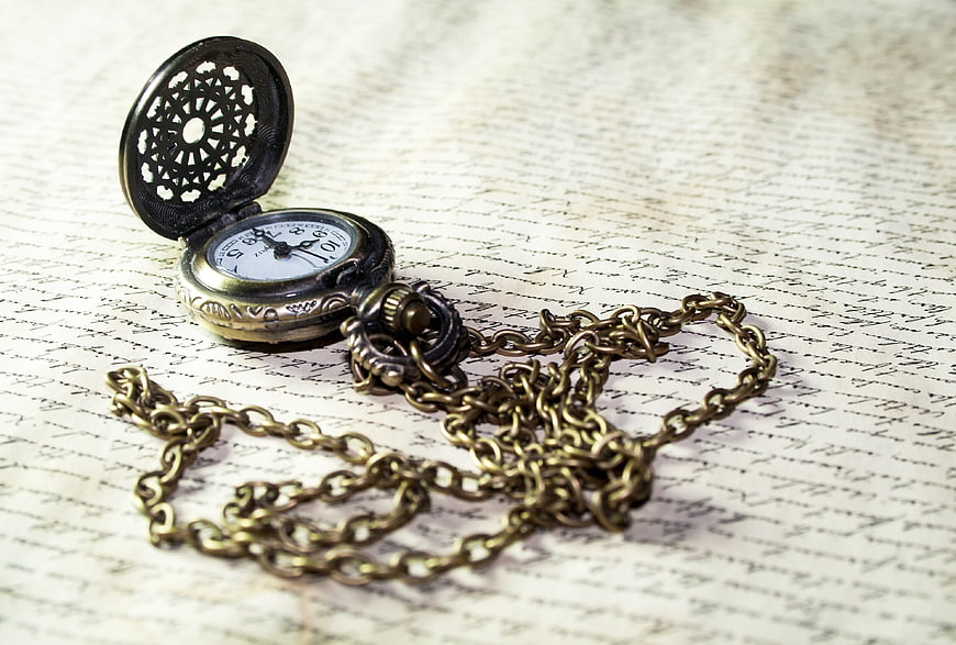 Vintage pocket watch with chain on handwritten letter