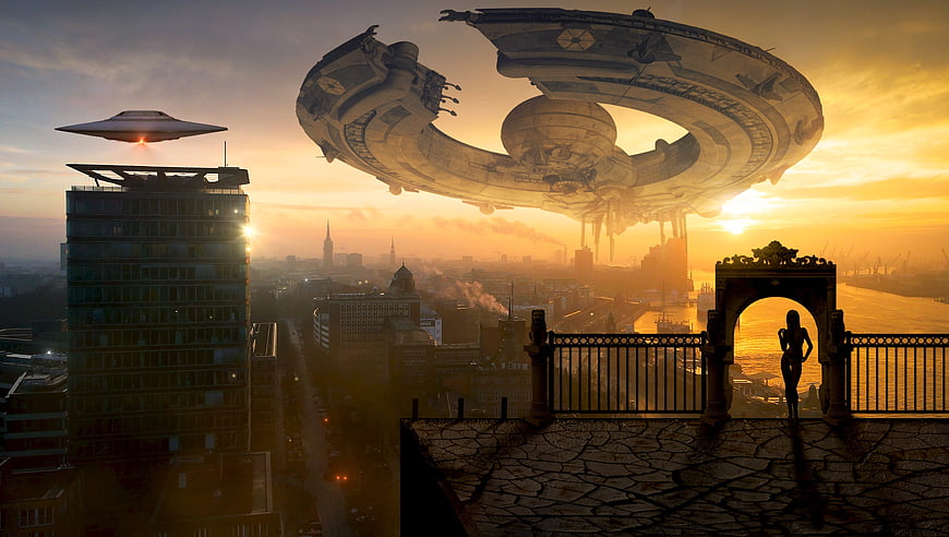 Futuristic UFO hovering over city skyline at sunset