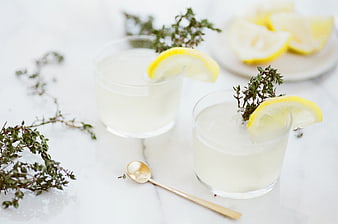 Refreshing Lemon Thyme Drink on White Marble
