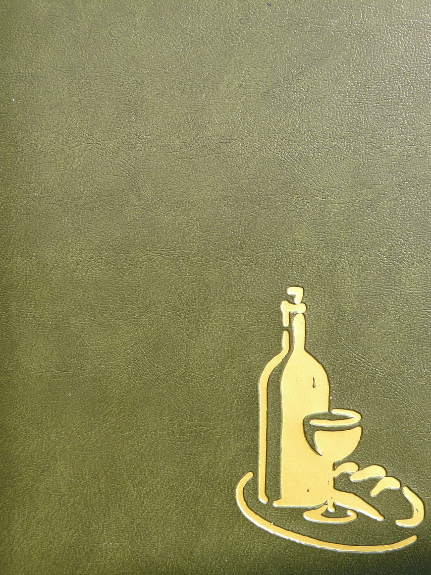 Gold Wine Bottle and Glass Logo on Green Leather Menu Cover