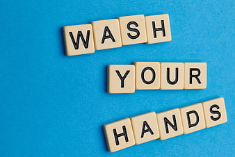 Wash Your Hands Scrabble Tiles on Blue Background