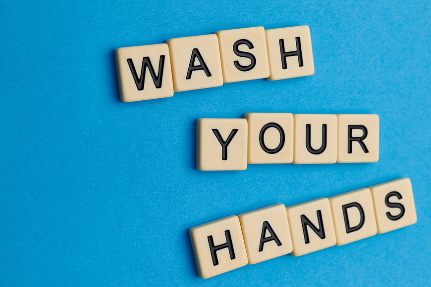 Wash Your Hands Scrabble Tiles on Blue Background