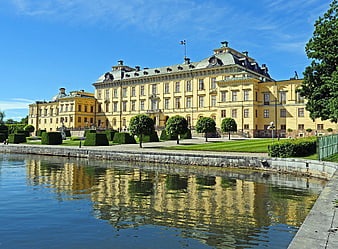 Drottningholm Palace in Stockholm, Sweden, Reflected in a Calm Water Garden