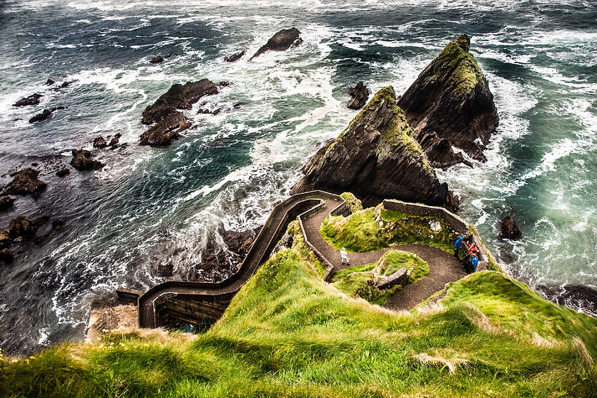 Dramatic coastal path winding along rugged Irish sea cliffs