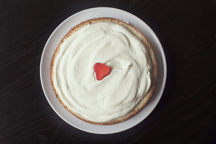 Top View of Vanilla Cake with Strawberry on Dark Table