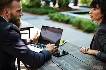 Business Meeting Outdoors with Laptop and Smartphone